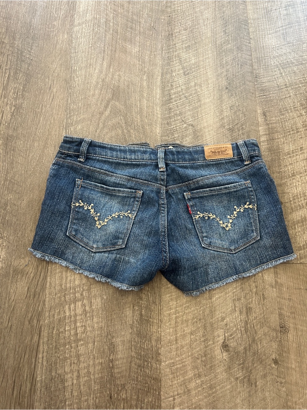 Levi's Blue Denim Women's Cutoff Shorts with Floral Embroidered Pockets